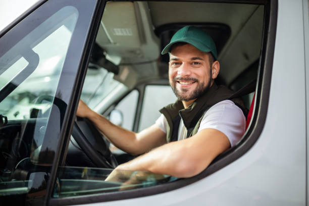 Tow truck operator on phone at roadside